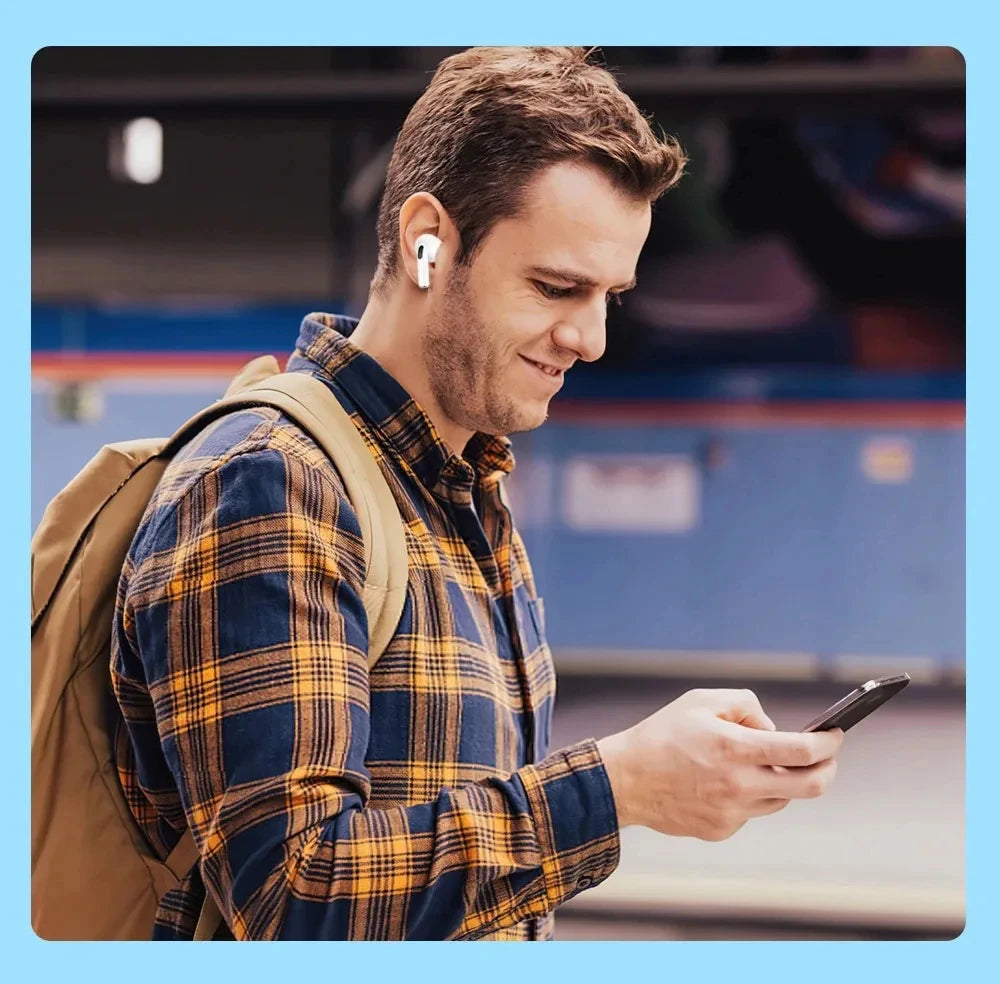 Man wearing Pro 5 Wireless Earbuds while using smartphone – clear calls and music on the go.